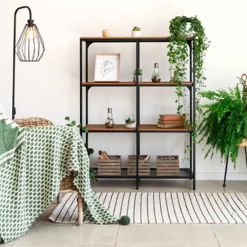 Industrial rack with indoor plants and other decorative items.