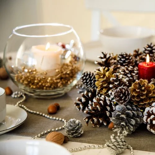Pinecones creatively used as natural accents, infusing a rustic charm into the Christmas table decor.