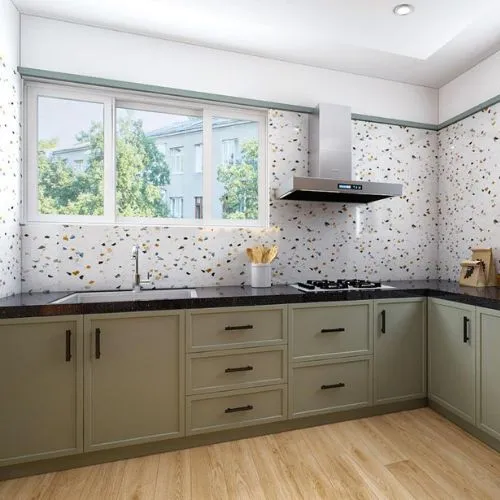 Sage green kitchen cabinets paired with vibrant terrazzo tiles, showcasing a modern and visually striking kitchen design.
