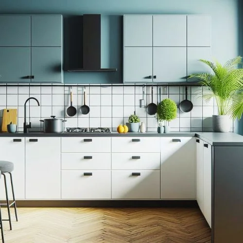 Kitchen with two-tone cabinets – white upper and trendy colour lower, both with black hardware.
