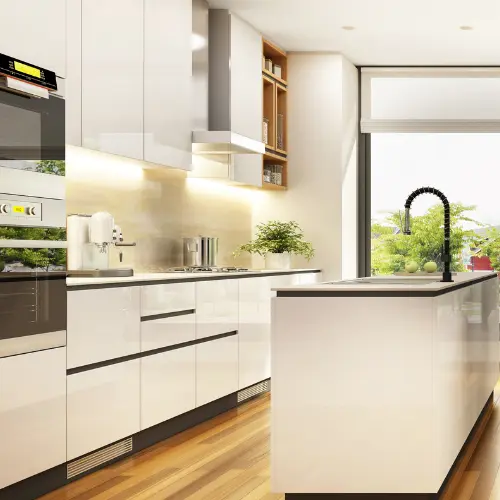 Kitchen showcasing the sleek aesthetic of white cabinets with black hardware.
