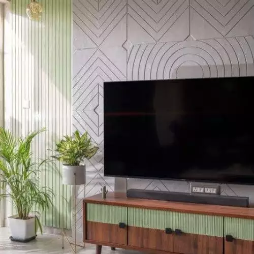 A modern living room featuring a textured brick wall to add texture in Interior Designing