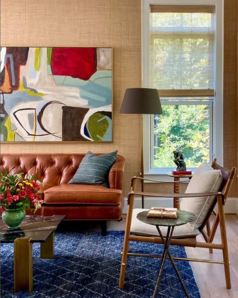 Budget friendly decor idea—textured wallpaper and bold wall art used to create a vibrant, character-filled statement wall.
