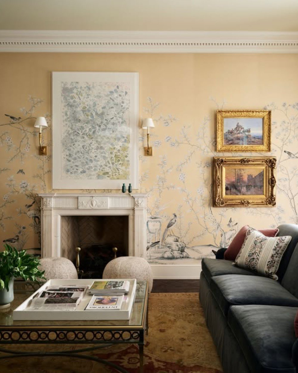 Drawing room image displaying brilliant play of texture. Texture is added through fabric of throw pillows, fabric wall art, wallpaper, floor rug and bean bags.