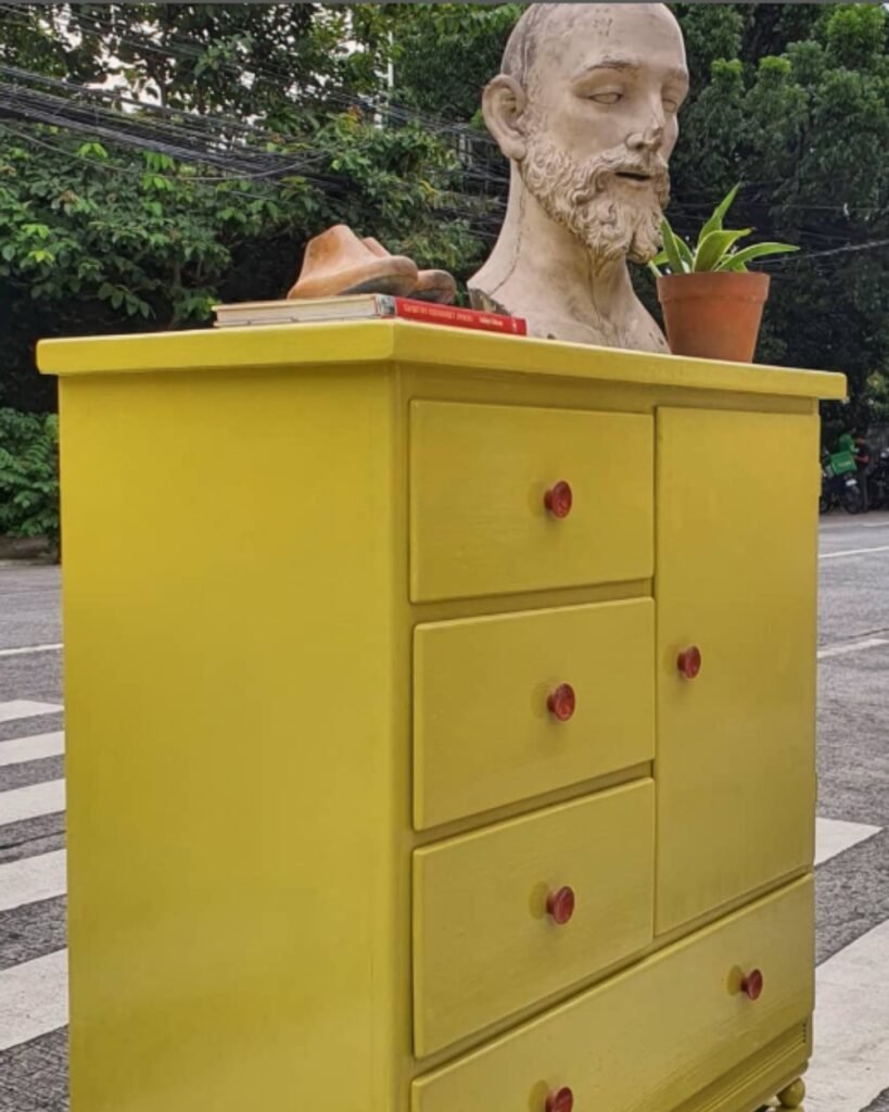 Repurposed old unit with drawers and shutters by simply painting in vibrant yellow colour