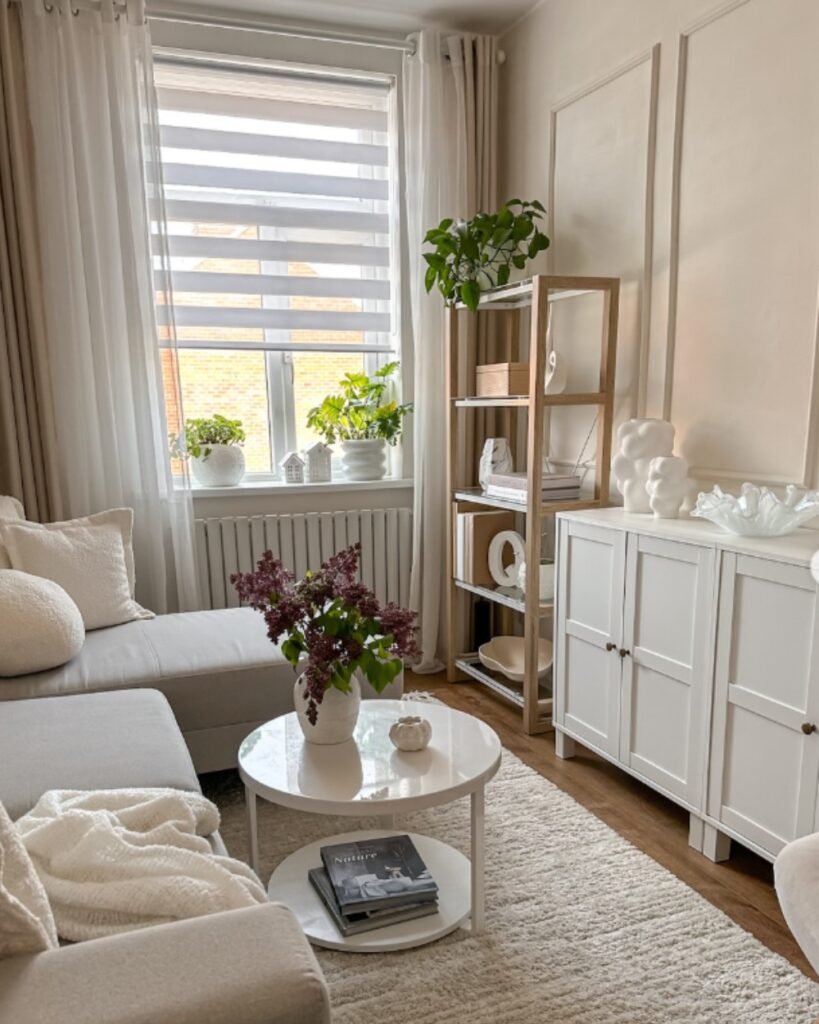 Budget friendly decor ideas with sheer curtains adding softness and light to a beige and white living room.