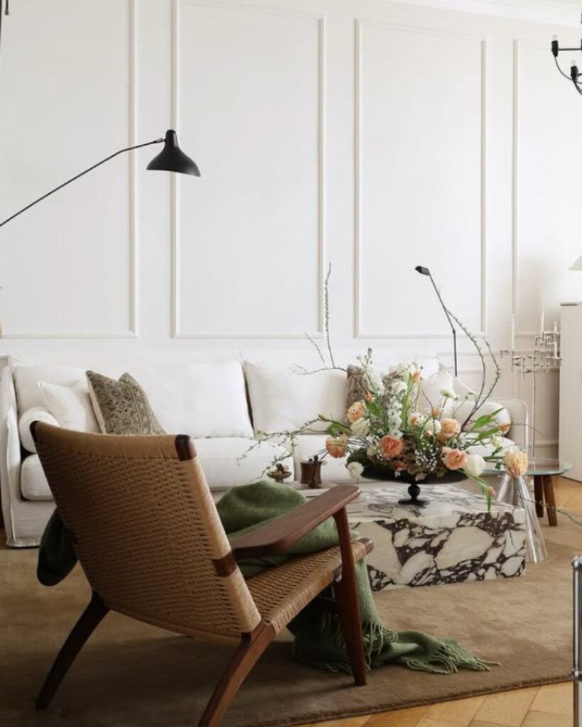 Wall molding painted in white—one of the budget friendly decor ideas used to add character to a living room wall without overspending.