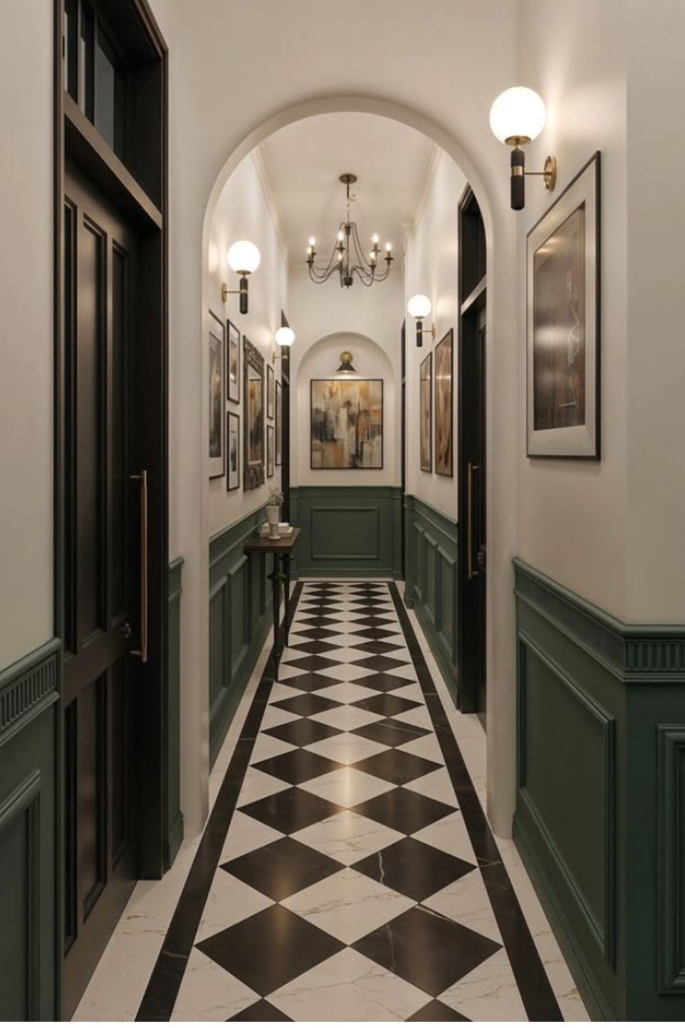 Narrow arched hallway with gallery walls, green panelling, and black and white checkered floor
