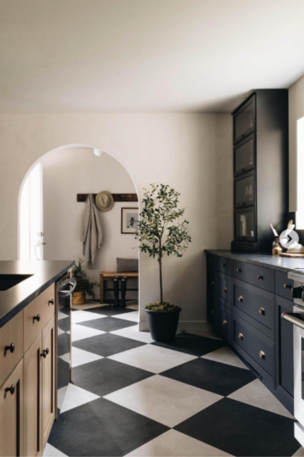 beautiful, diagonal black and white checkered floor in the kitchen