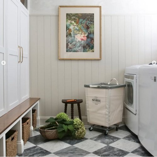 Laundry room with white furniture and checkered flooring
