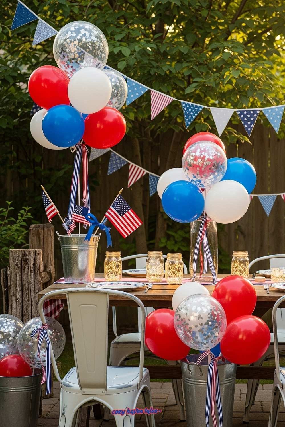 Balloons styled in galvanized buckets and confetti balloons tied with ribbons for patriotic decor.