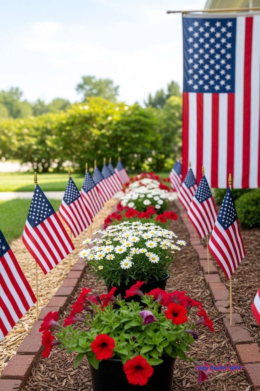 Mini American flags lining a garden pathway for 4th of July entrance decor.