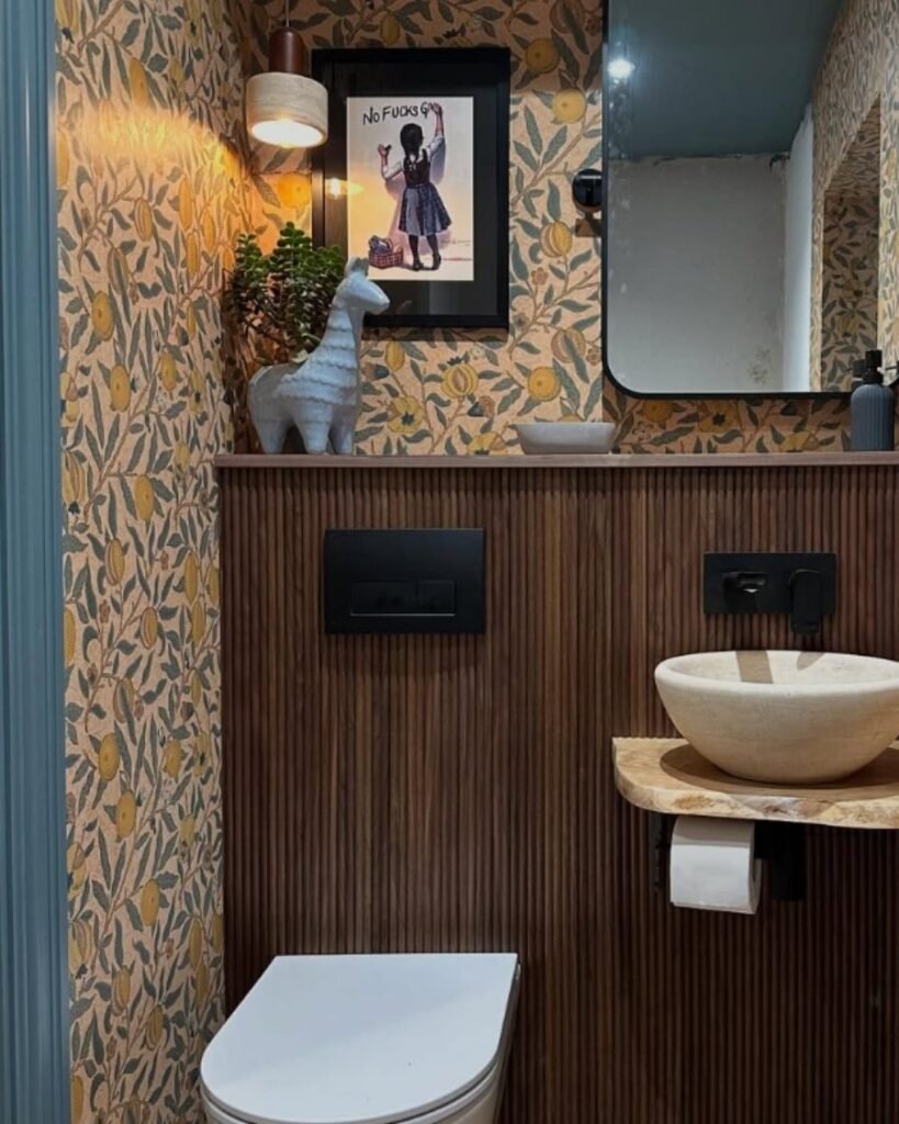 lemon‑leaf wallpaper, wood slats, stone sink