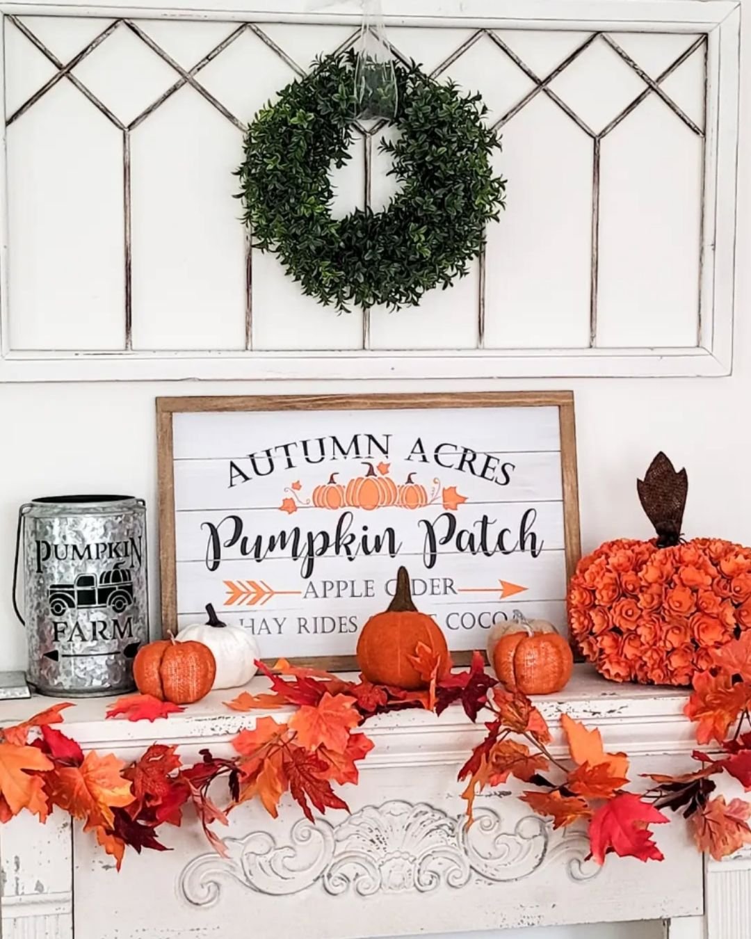 Simple fall mantel decorating ideas with a pumpkin patch sign, farmhouse metal accents, and autumn leaf garland.