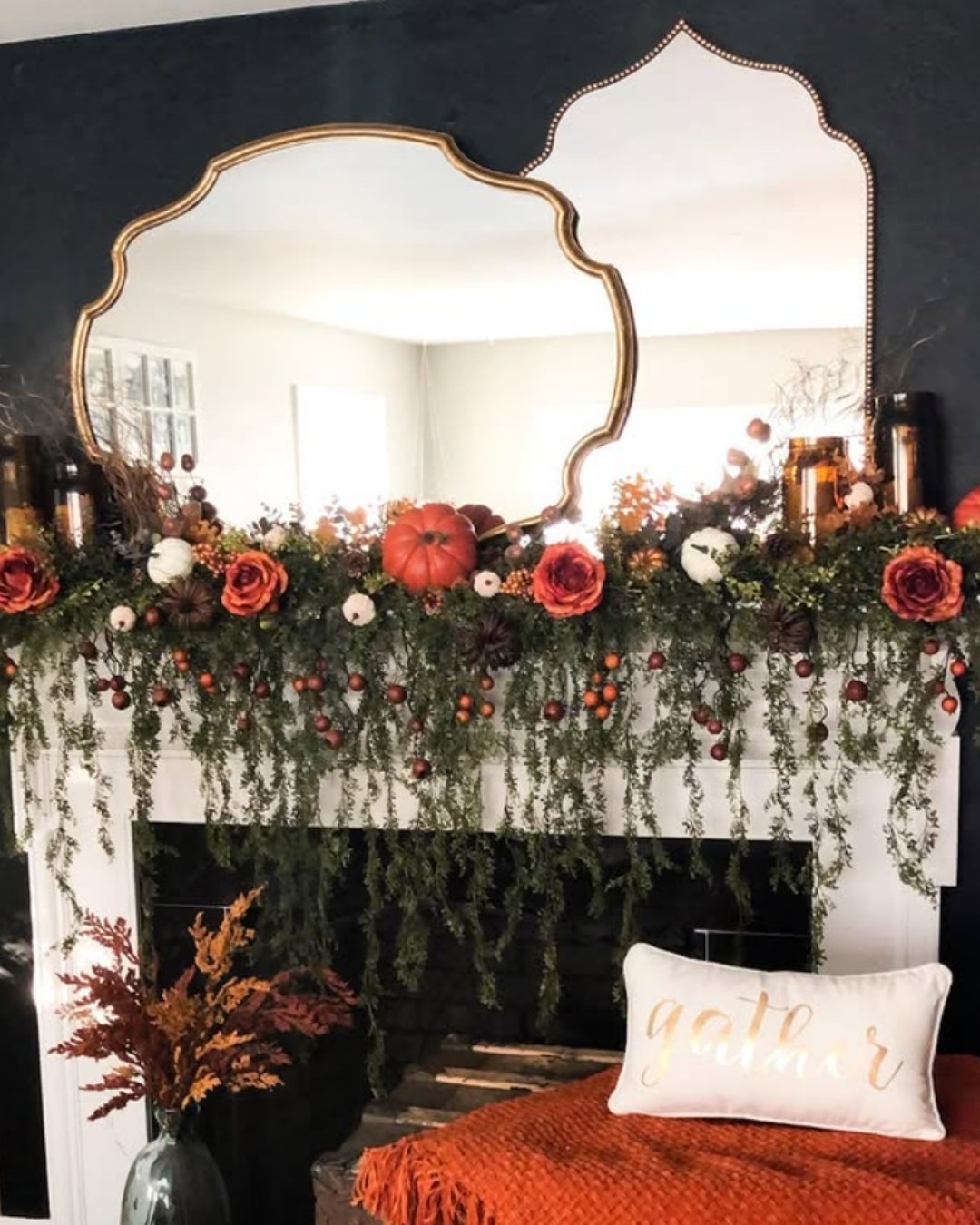 Dramatic fall mantel decorating ideas with lush floral garlands, trailing greenery, and dark accent walls.