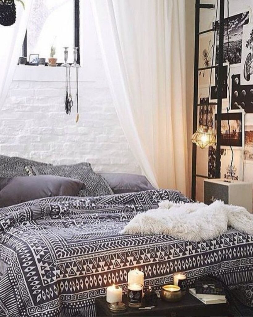 Black and white Moroccan boho bedroom with canopy, tribal textiles, and soft lighting