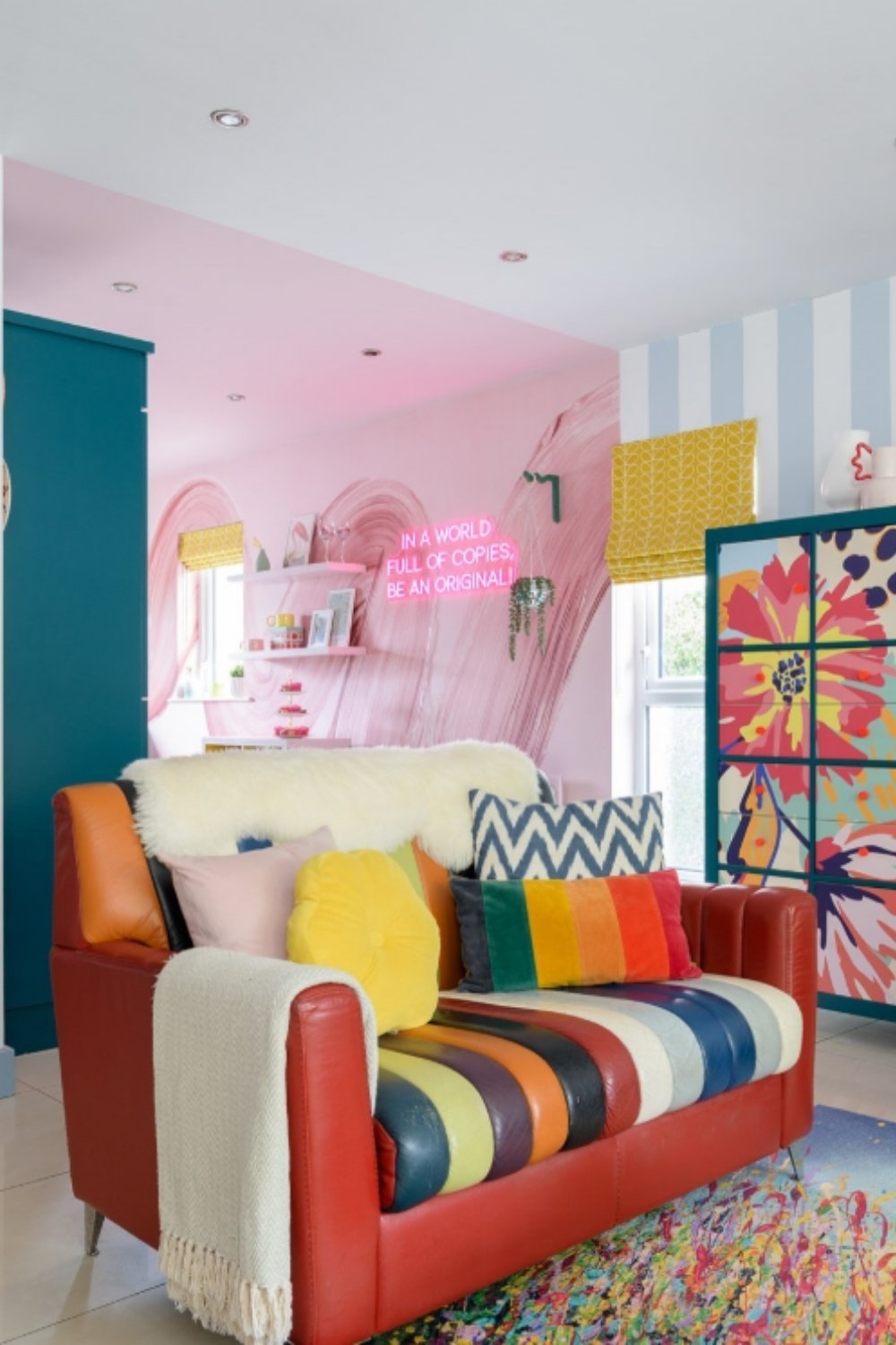 Colorful striped loveseat in a vibrant pop-art themed living room