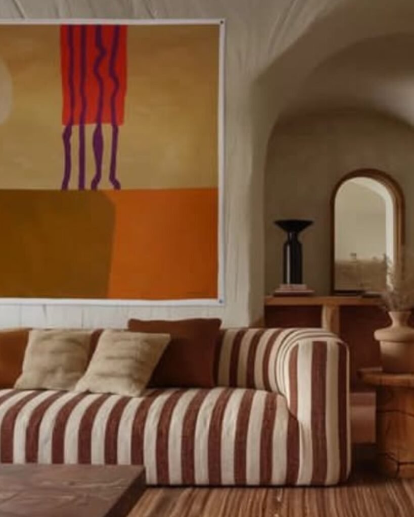 Earth-toned striped sofa in a warm bohemian-style living room