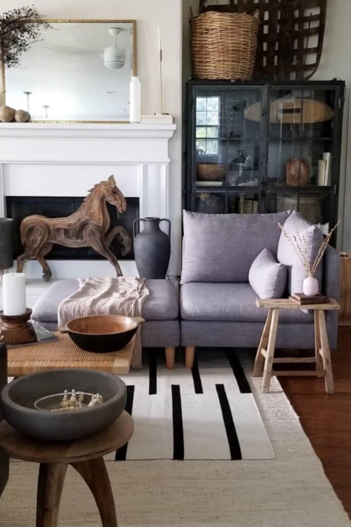 Light purple sofa in a Scandinavian-style room with wood decor and a cream rug.