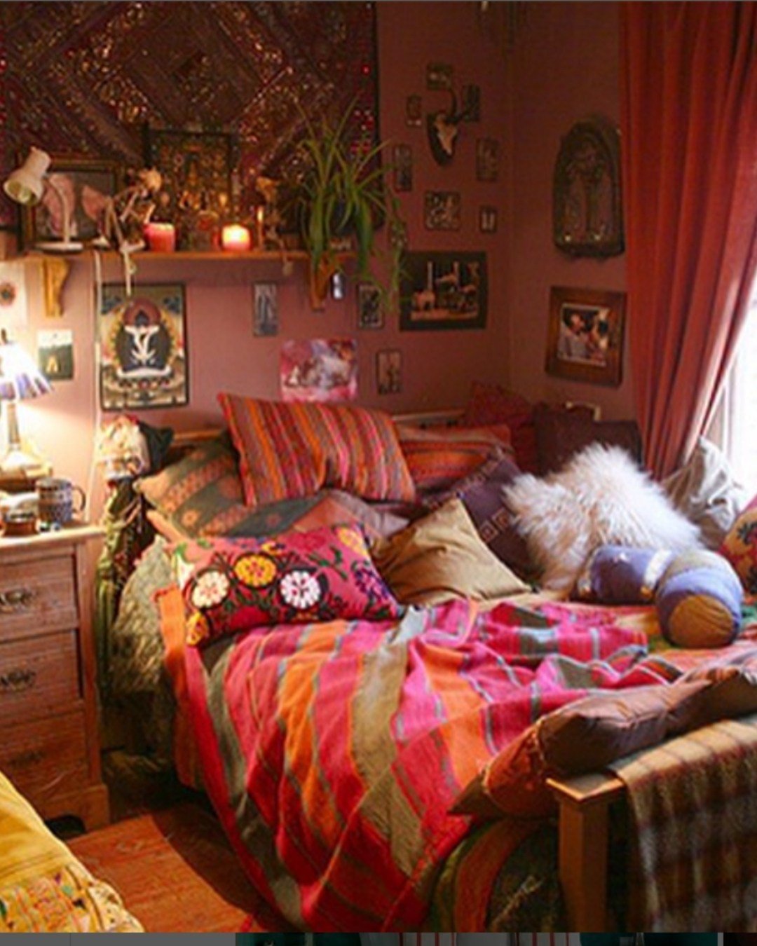 Colorful with layered bedding, wall art, and eclectic pillows