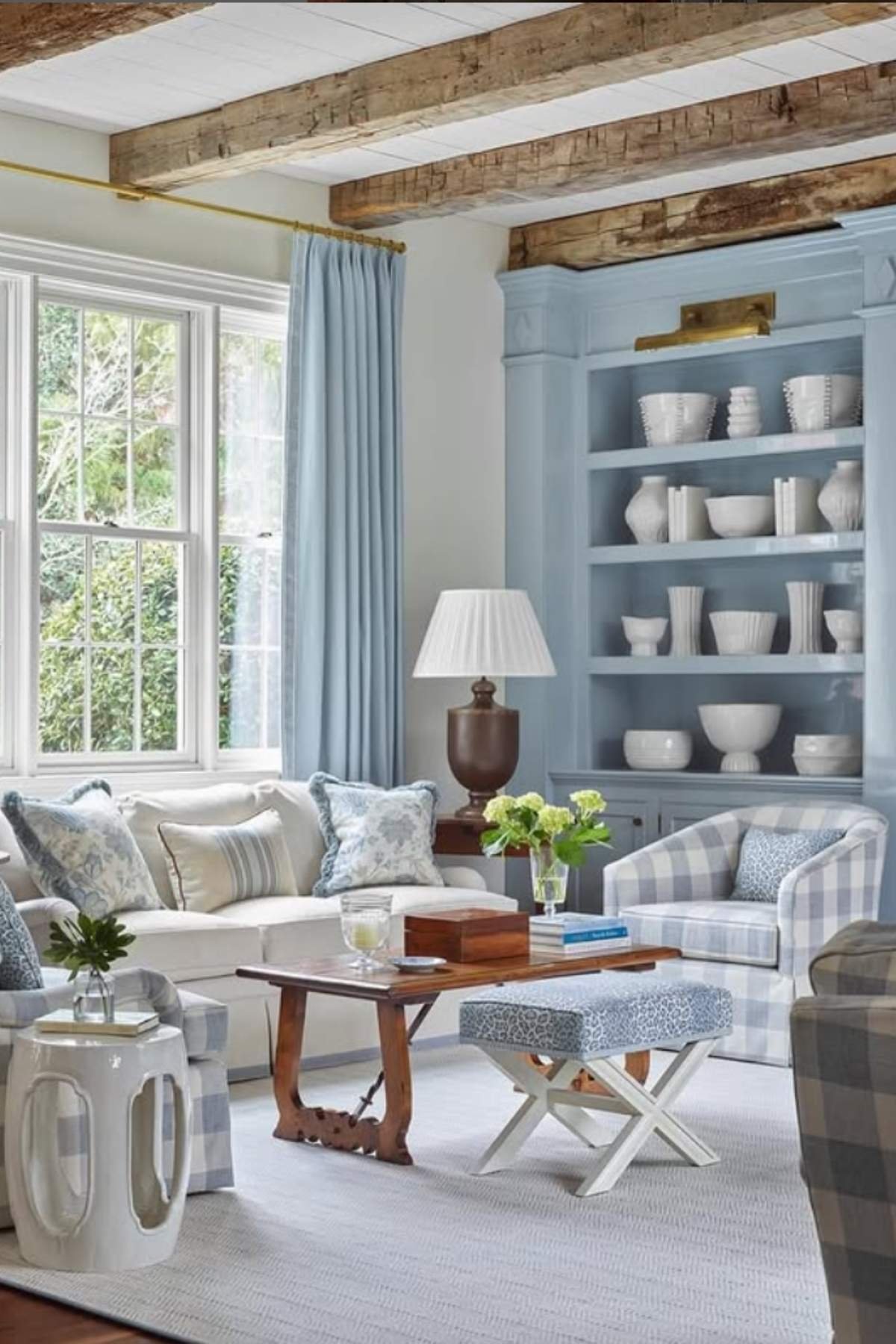 Monochrome layered blues with rustic beams and light blue wall paint color.