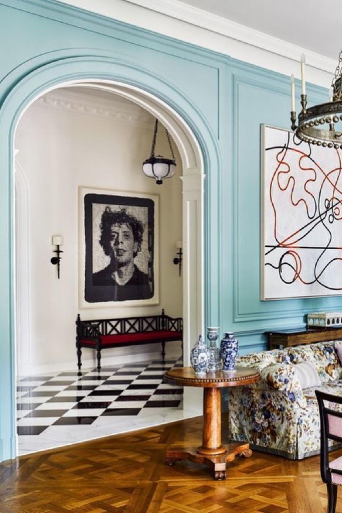 Aqua trim framing doorway with checkered floor.