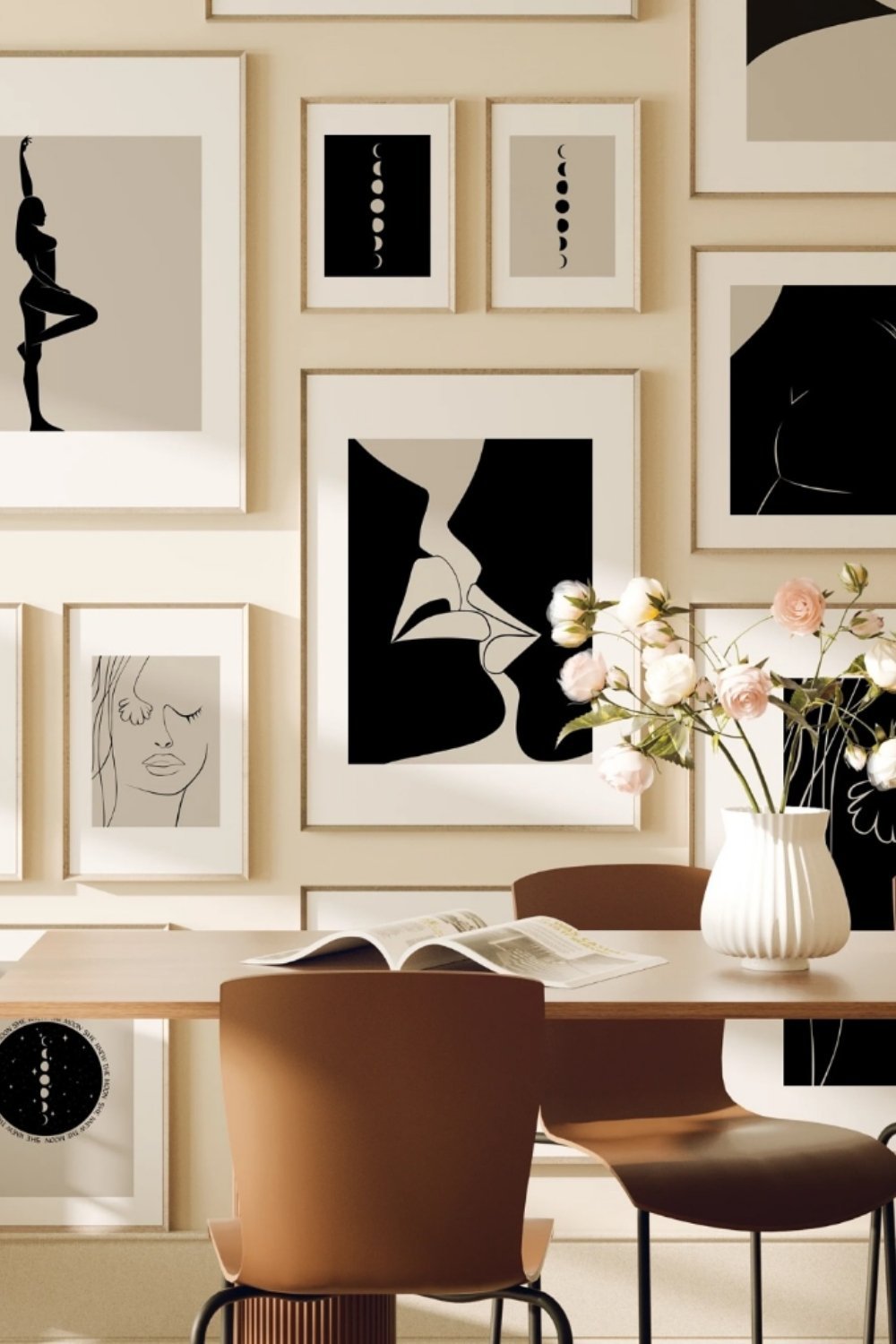 Elegant black-and-white gallery wall above dining table with neutral background and warm accents.