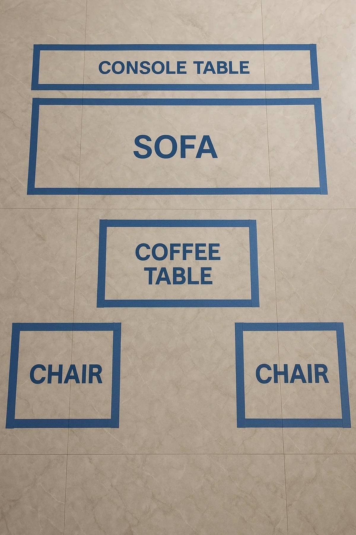 Small apartment living room layout planning with taped furniture outlines for sofa, chairs, console table, and coffee table.