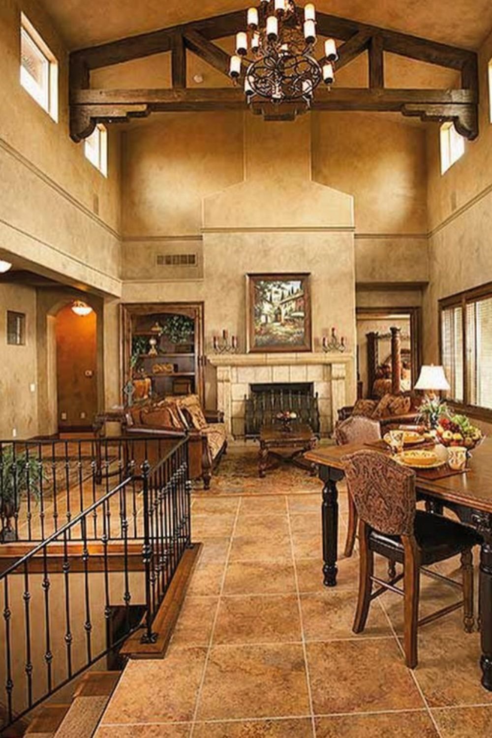Dining and living room with high ceilings and stone fireplace