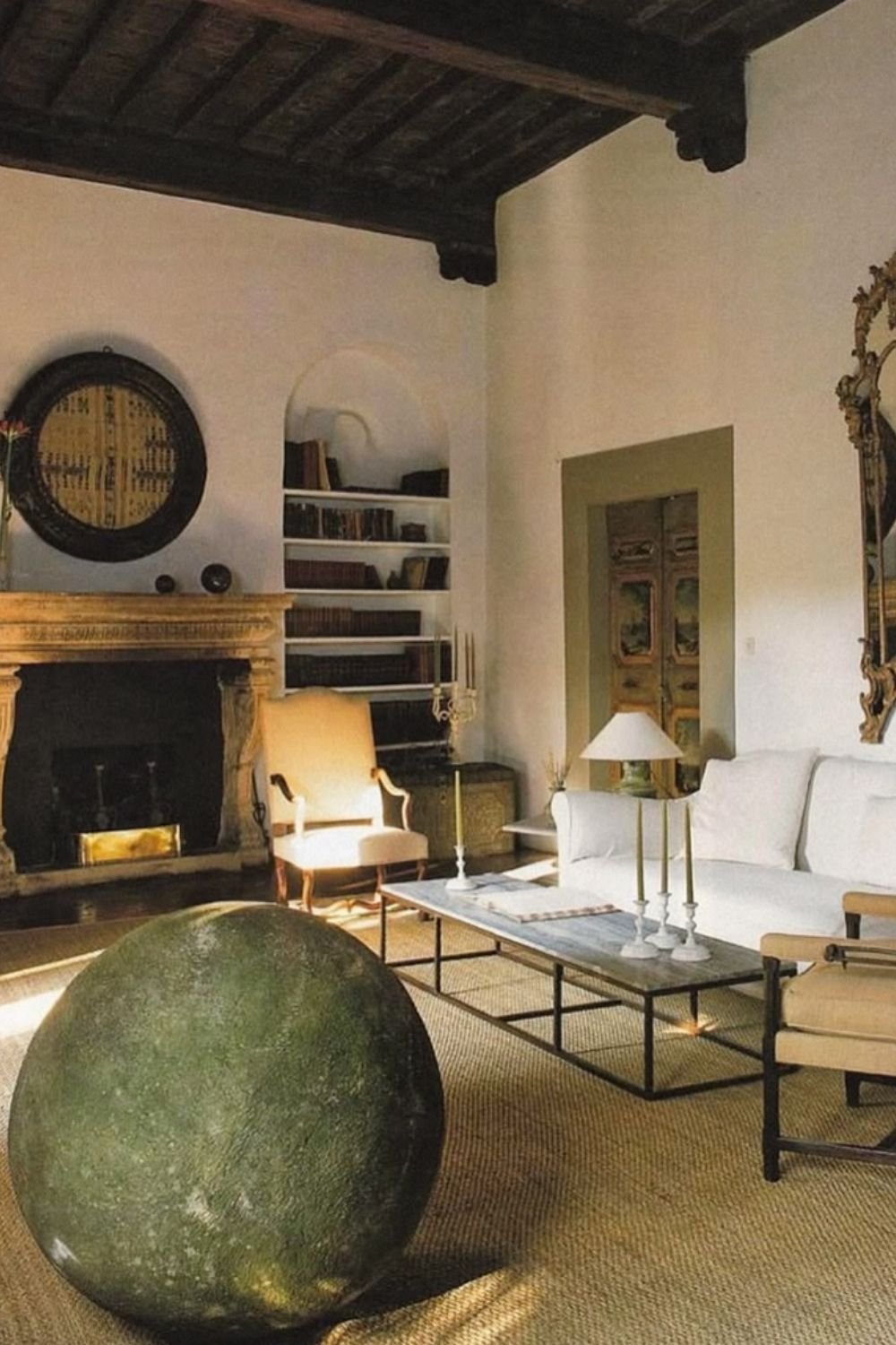 Living room with arched fireplace and rustic decor