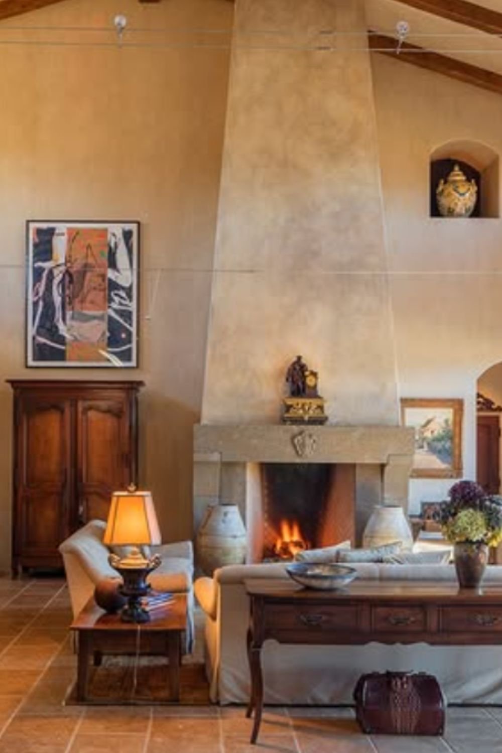 Traditional tuscan living room with fireplace, earthy textures, and wooden furniture – tuscan style home interior design