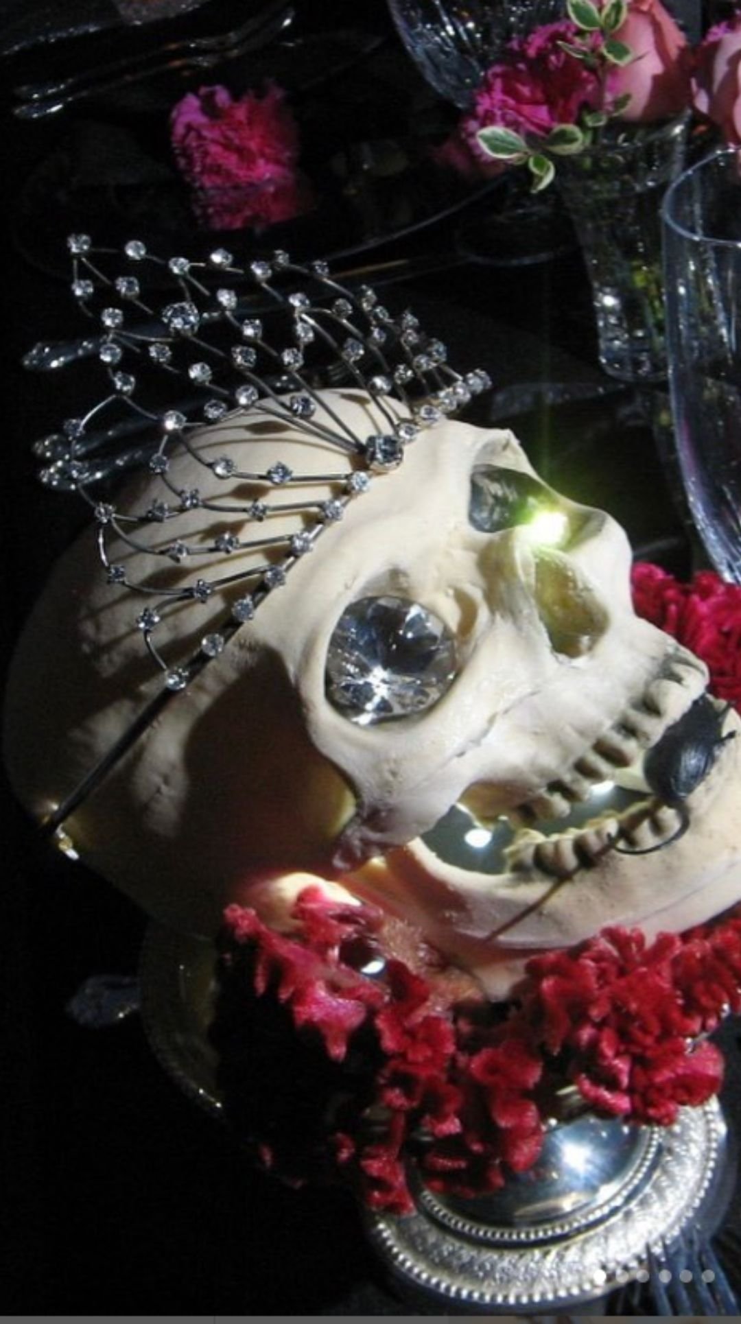 Halloween centerpiece skull with crystal crown and red flower accents