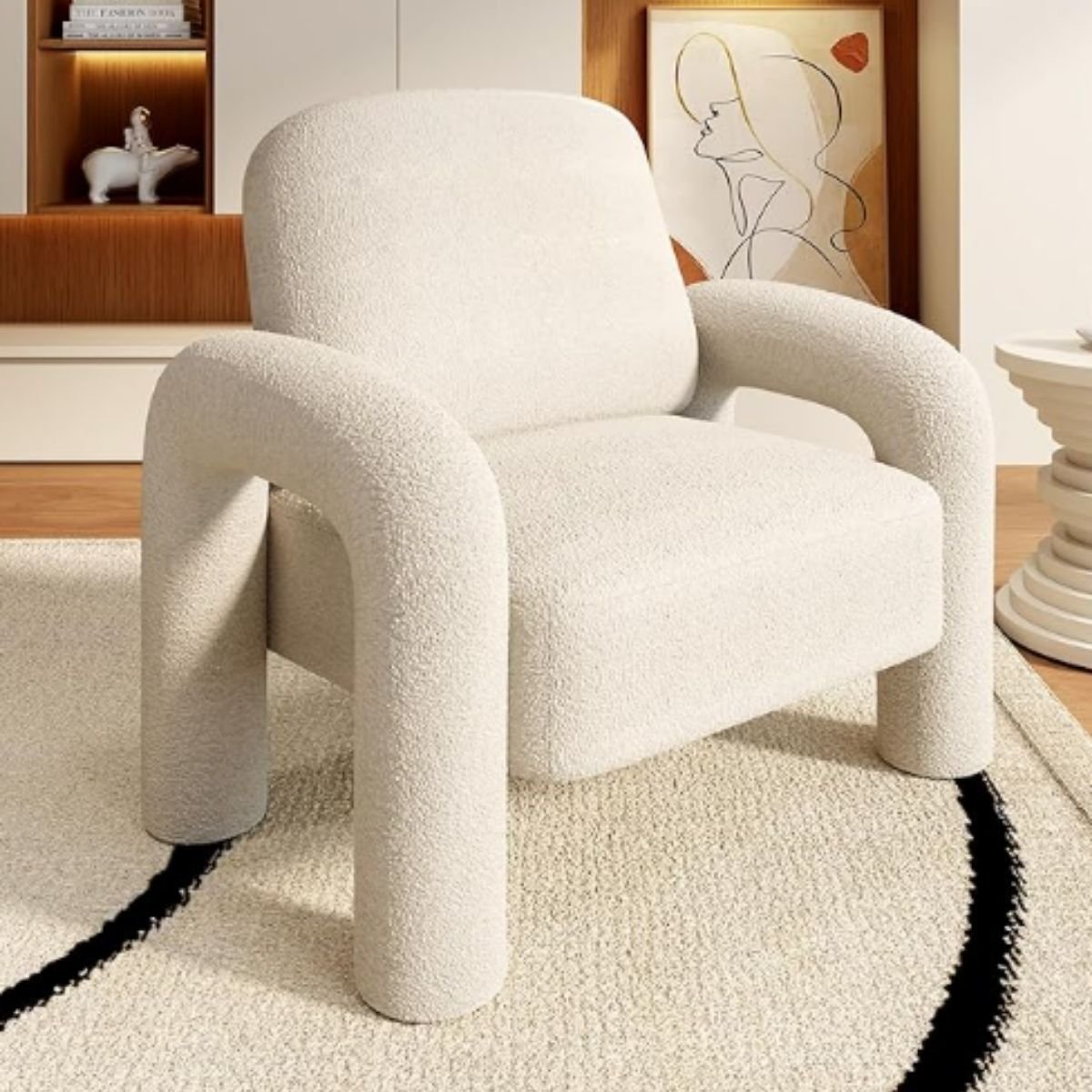 Curved sherpa armchair with sculptural elephant-trunk armrests in a modern living room.