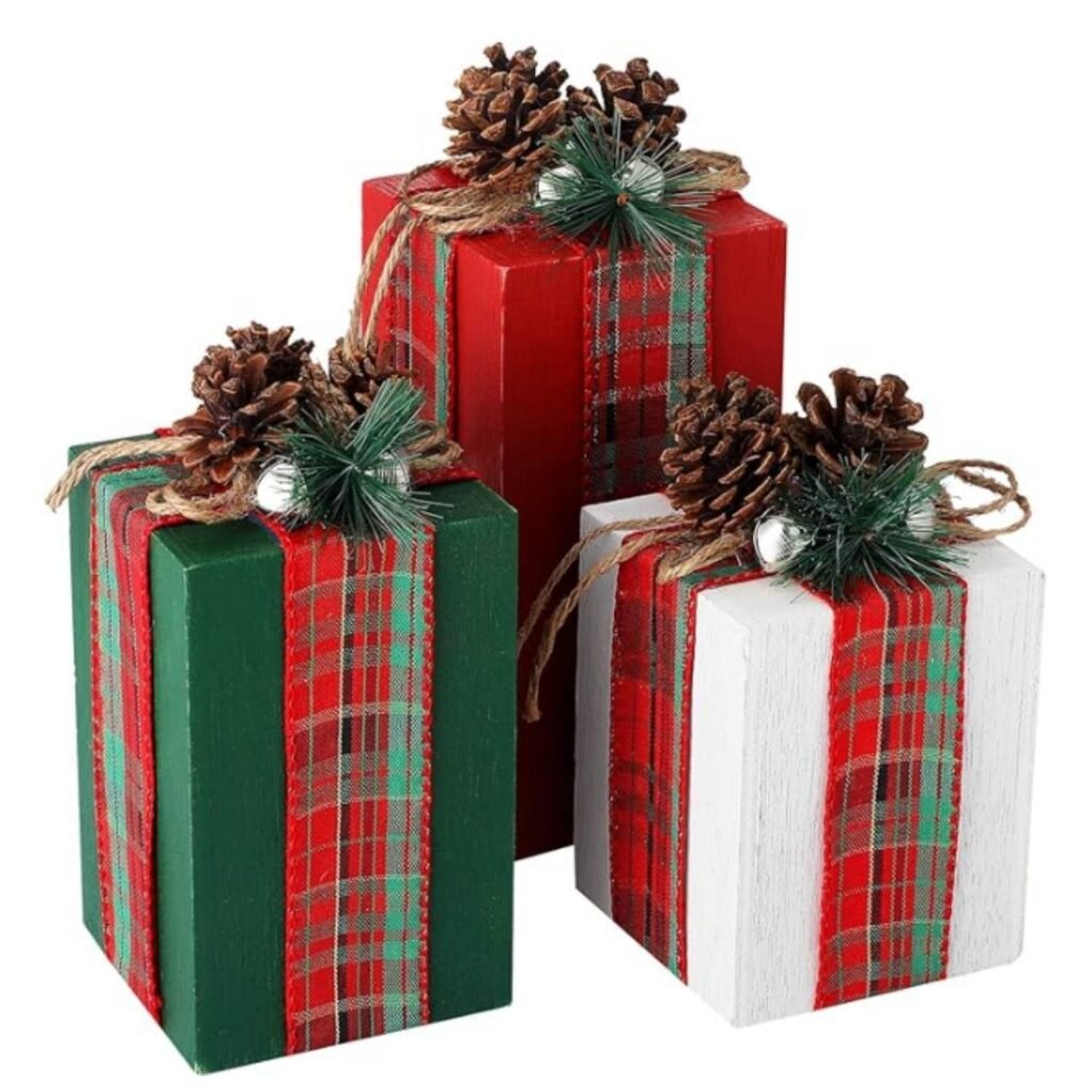 Set of rustic wooden Christmas gift blocks decorated with plaid ribbon, pinecones, and twine.