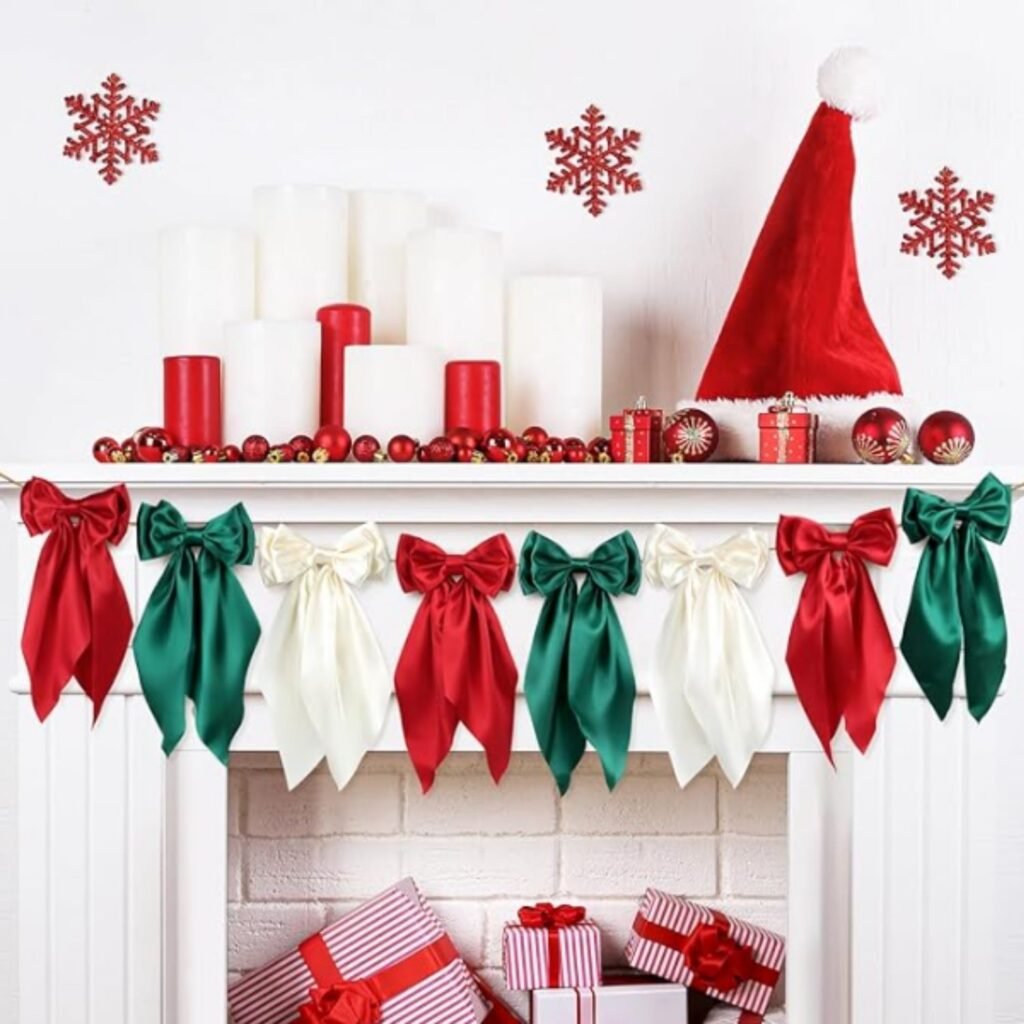 Christmas mantel decorated with satin ribbon bow garland in red, green, and ivory, paired with candles and festive ornaments.