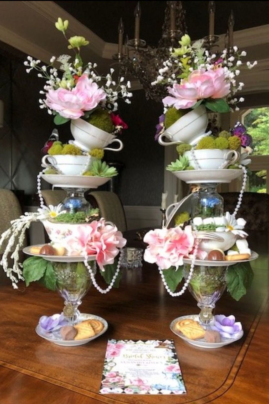 tiered teacup stand filled with flowers and plants