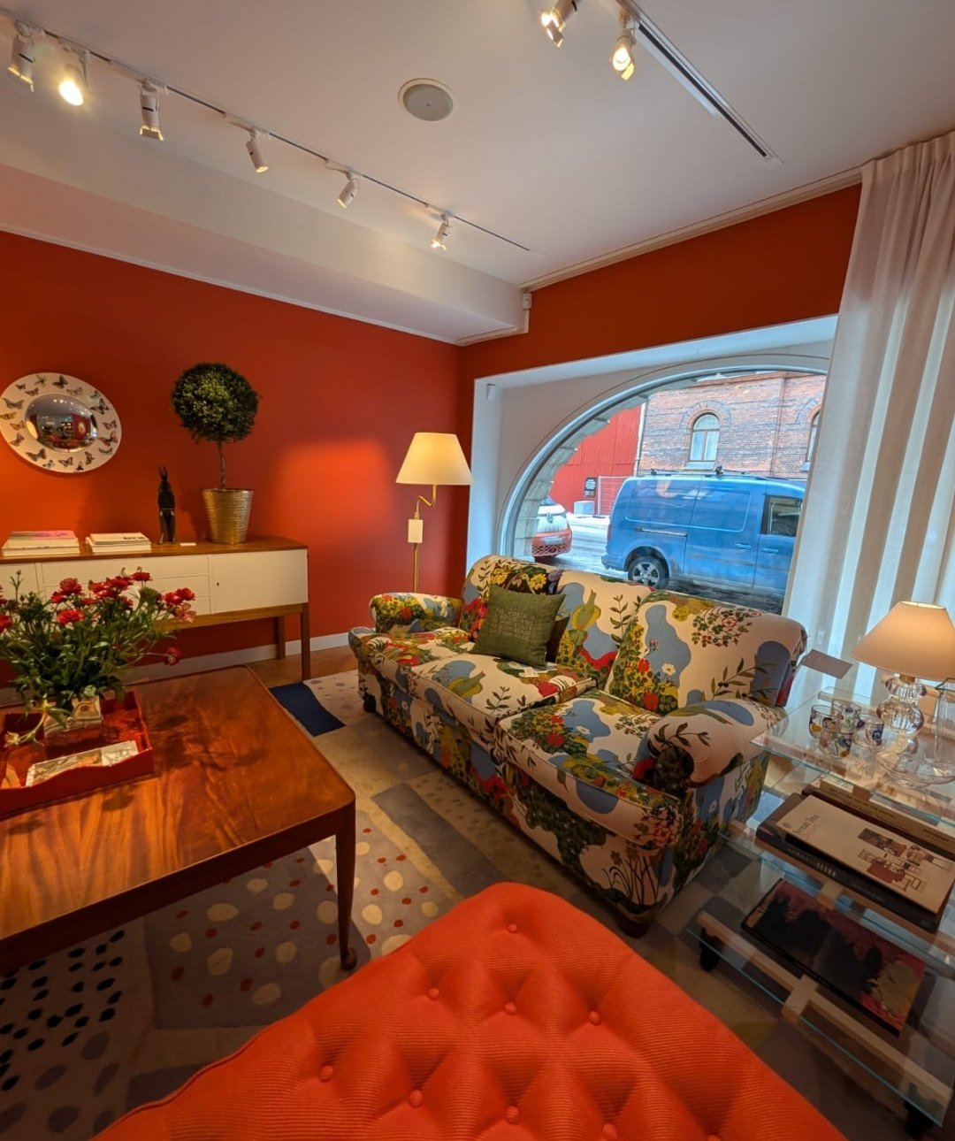 Warm Svenskt Tenn living space with bold colors and cozy Scandinavian interiors