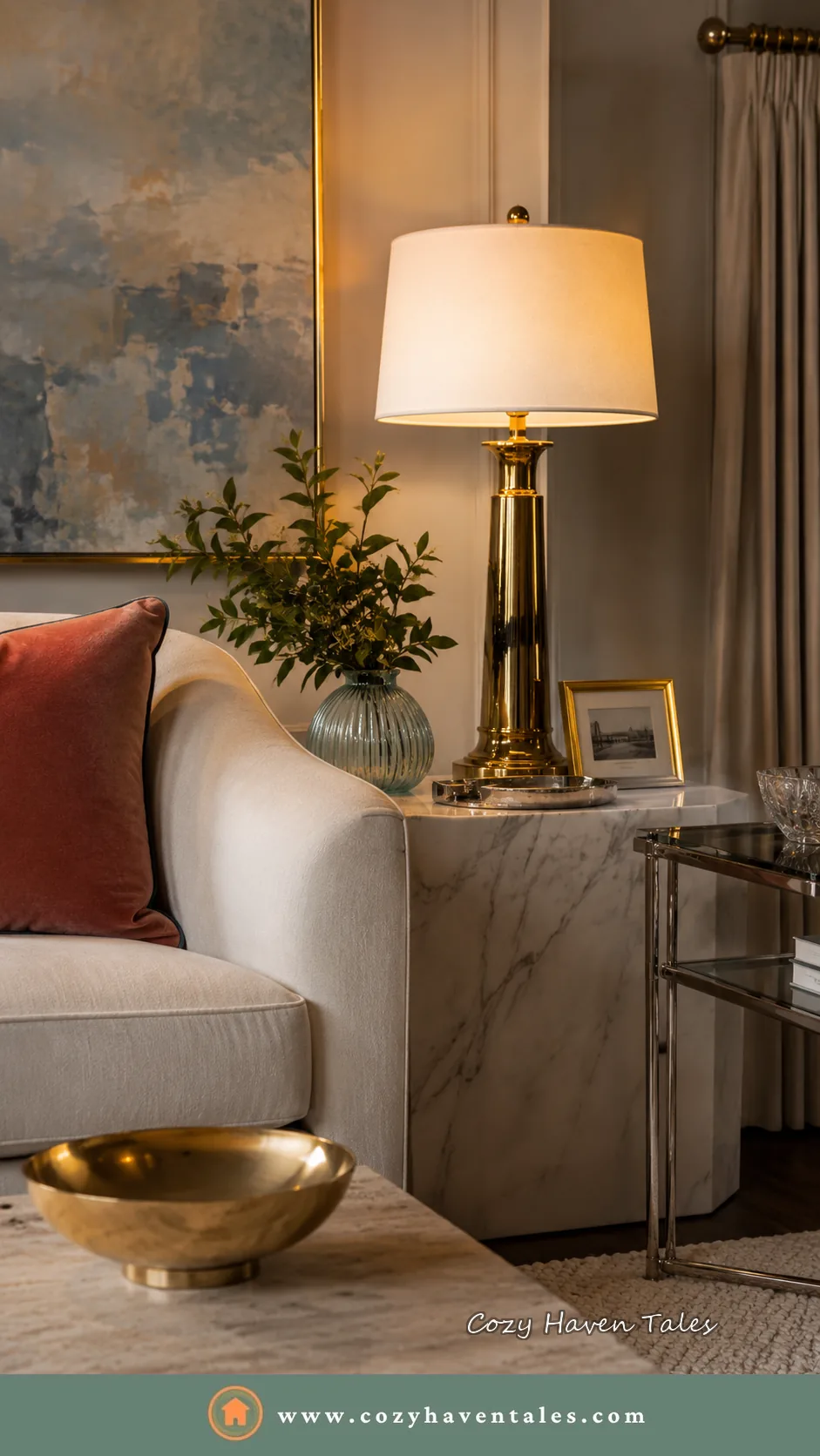 Close up of a brass table lamp, a neutral sofa and a terracotta pillow adding warm color to brighten a corner