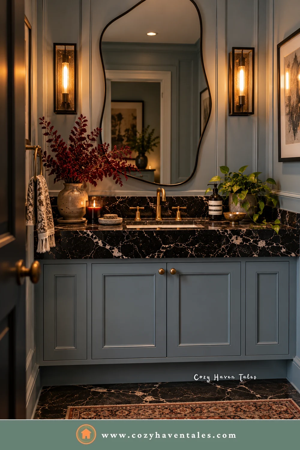 Powder room with a black marble vanity top, an aged brass faucet, and a blue-gray cabinet base