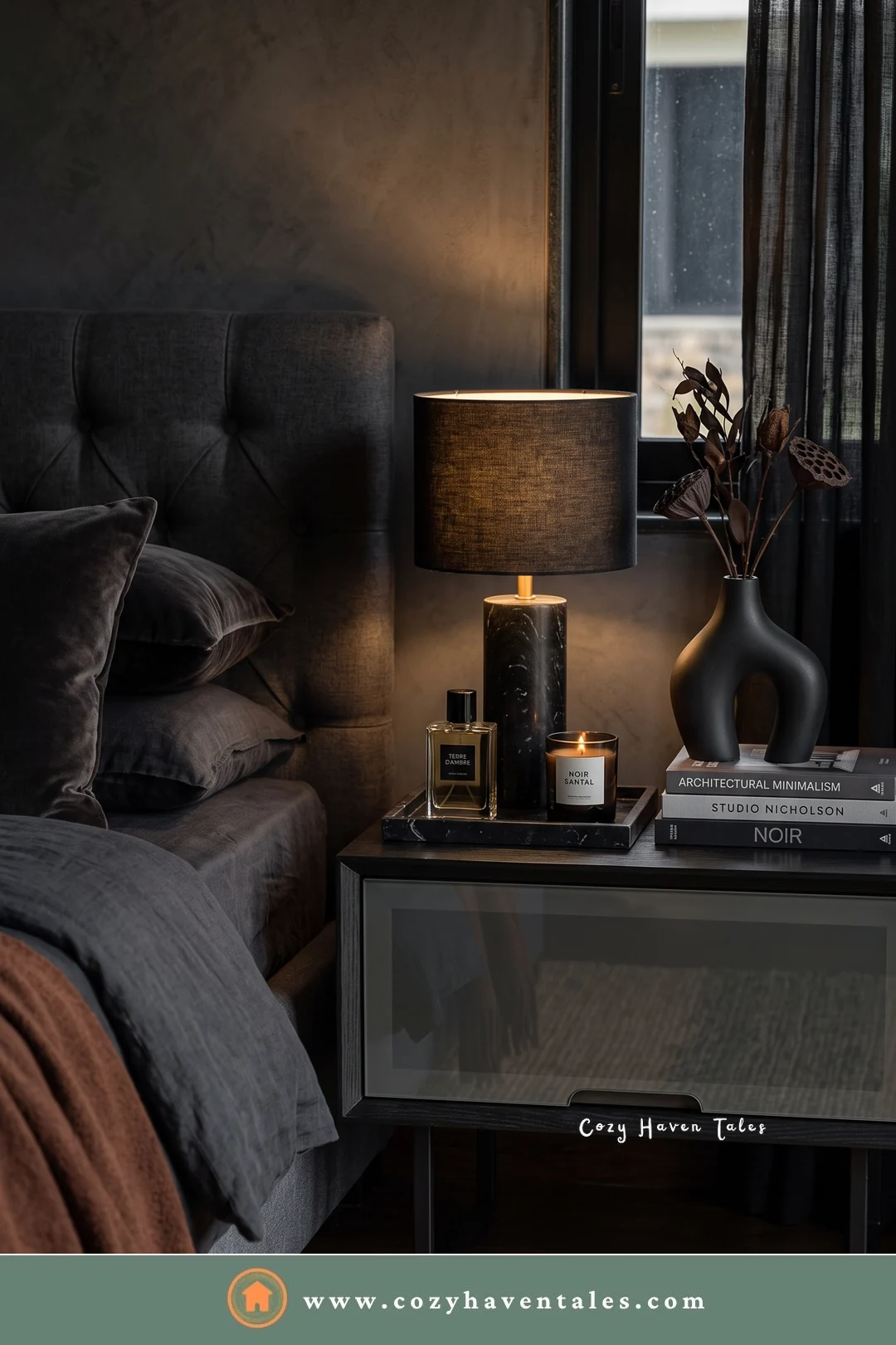 Smoked glass and black metal bedside nightstand with a dark lamp and black vases