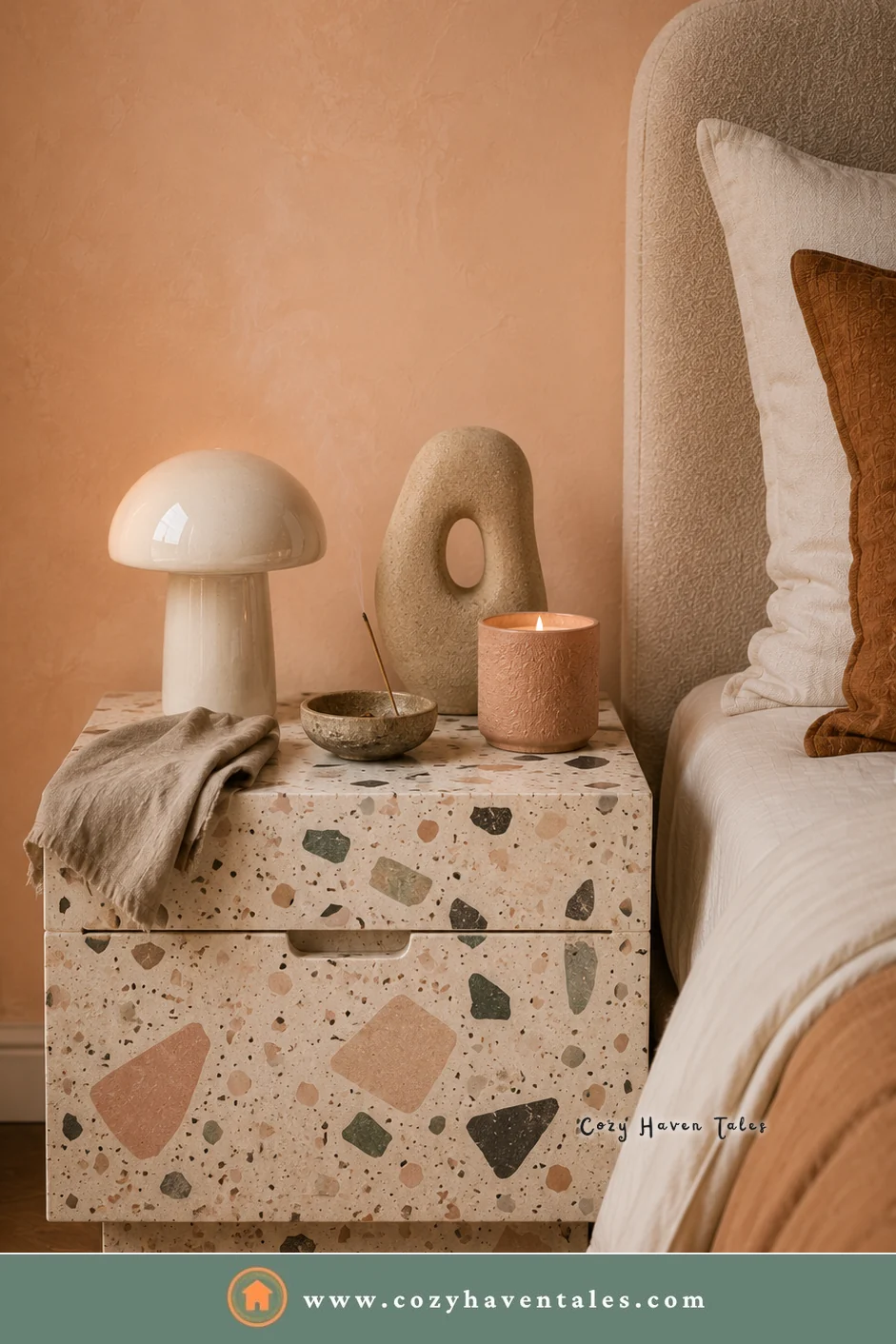 Terrazzo bedside nightstand with colorful stone chips, a mushroom lamp, and a sculpture against a peach wall