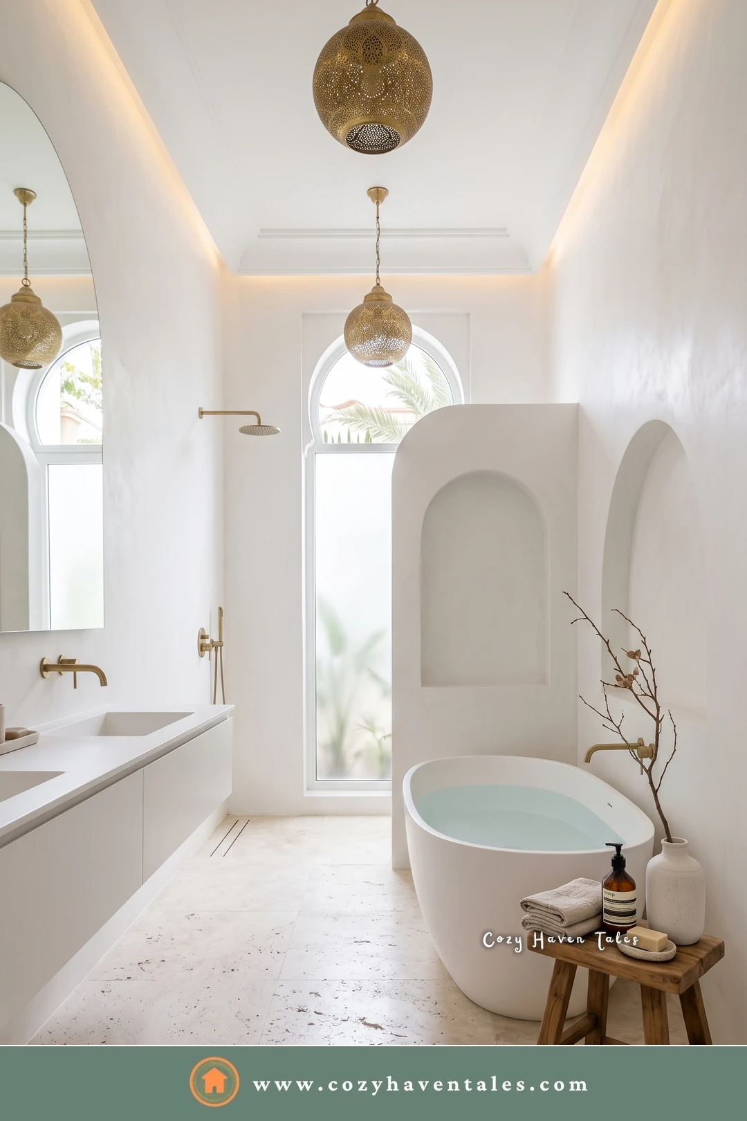 Bright white bathroom with sculpted plaster arches, gold globe lanterns, and a freestanding tub